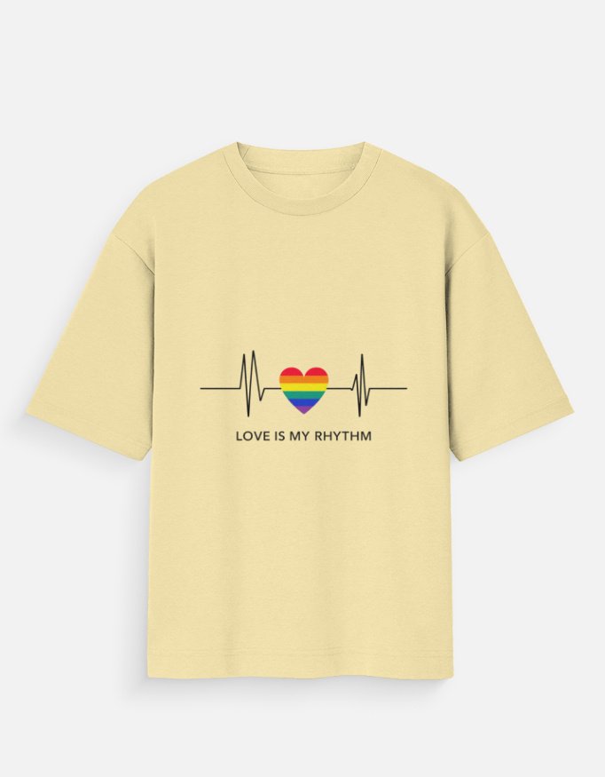 Girl Wearing White Pride Heart T-Shirt in Cozy Cafe - Image 2